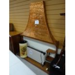 A vintage wooden fire surround, copper hood, electric fan heater etc