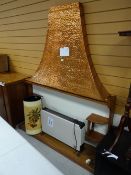 A vintage wooden fire surround, copper hood, electric fan heater etc