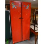 A painted pine two-door cupboard and a pine chest of drawers