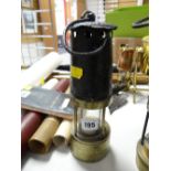 An early antique miners lamp imprinted no. 588