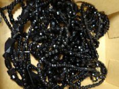 A quantity of black beads (possibly jet)