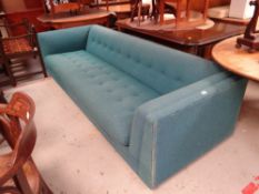 A large retro buttoned fabric sofa circa 1960s / 70s