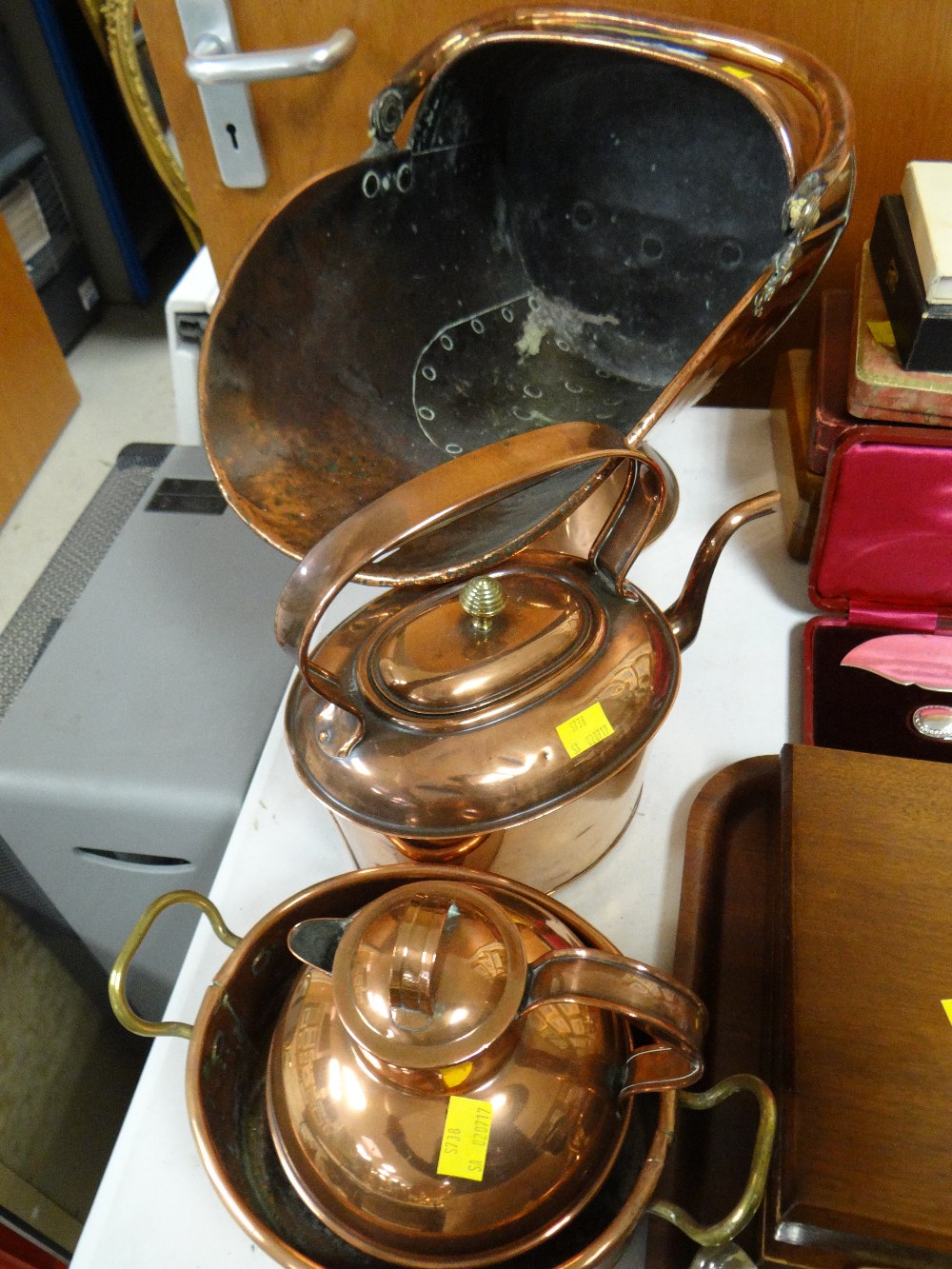 A good beaten copper helmet coal scuttle, a copper kettle and two further items of copper