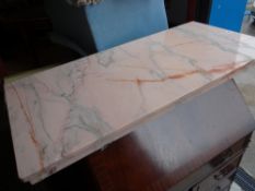 A slab of veined pink marble
