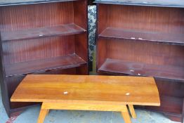 A pair of mahogany effect open bookcases and a coffee table