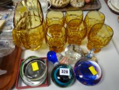 An amber glass lemonade set and sundry glass paperweights etc