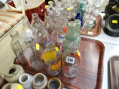 A collection of late twentieth century advertising glass milk bottles and a pair of earlier soda