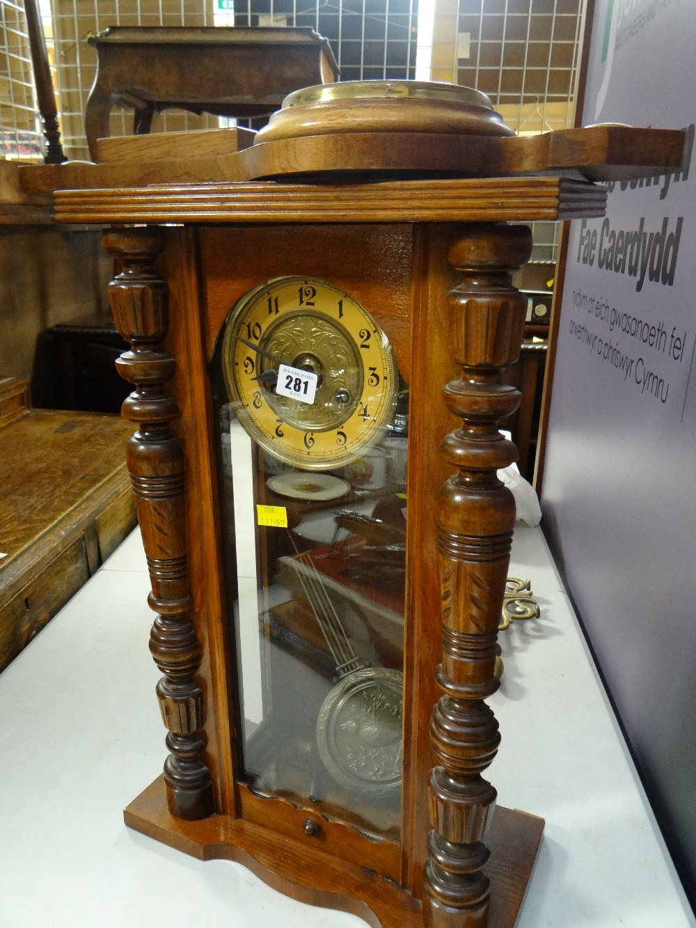 A Vienna-style wall clock and an oak encased barometer