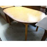 An oval extending dining table