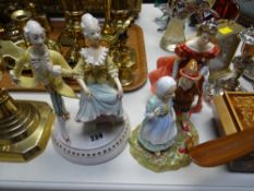 A Royal Doulton figurine 'Winsome' HN220 together with a Paragon Hansel & Grethel group and a