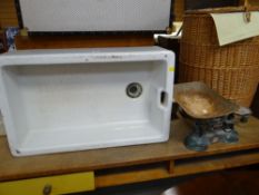 A vintage ceramic Belfast sink and an old set of Carnegie & Layton scales