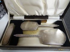 A cased four-piece silver machine turned dressing table brush and mirror set