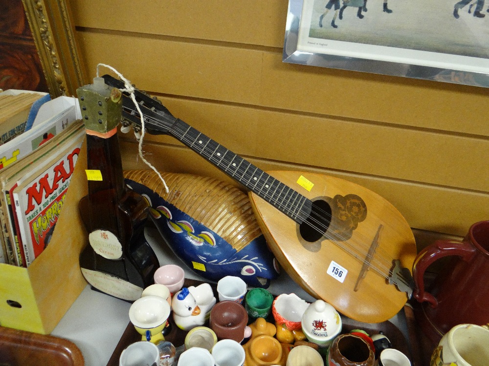 A Russian mandolin, a novelty bottle for Harmony Cream etc