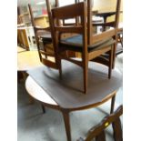 Nathan-Suite circular extending dining table and four chairs