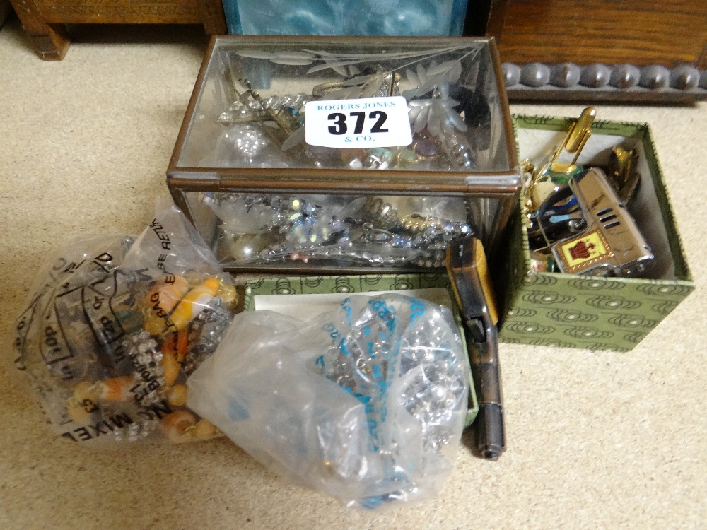 A parcel of jewellery, a glass casket of jewellery etc