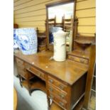 A good Edwardian kneehole dressing table by Trapnell & Gane with centre mirror