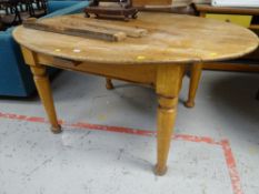 A lightwood oval kitchen table
