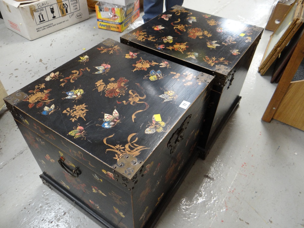 A pair of lacquer-ware bedside chests decorated with nature scenes including butterflies and