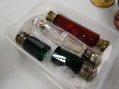 Two antique double-ended scent bottles, one in cranberry glass and another (damaged)