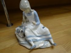 A Nao porcelain figure of a girl and goat