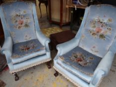 A pair of mid-twentieth century blue floral upholstered armchairs, a fabric covered box seat, and