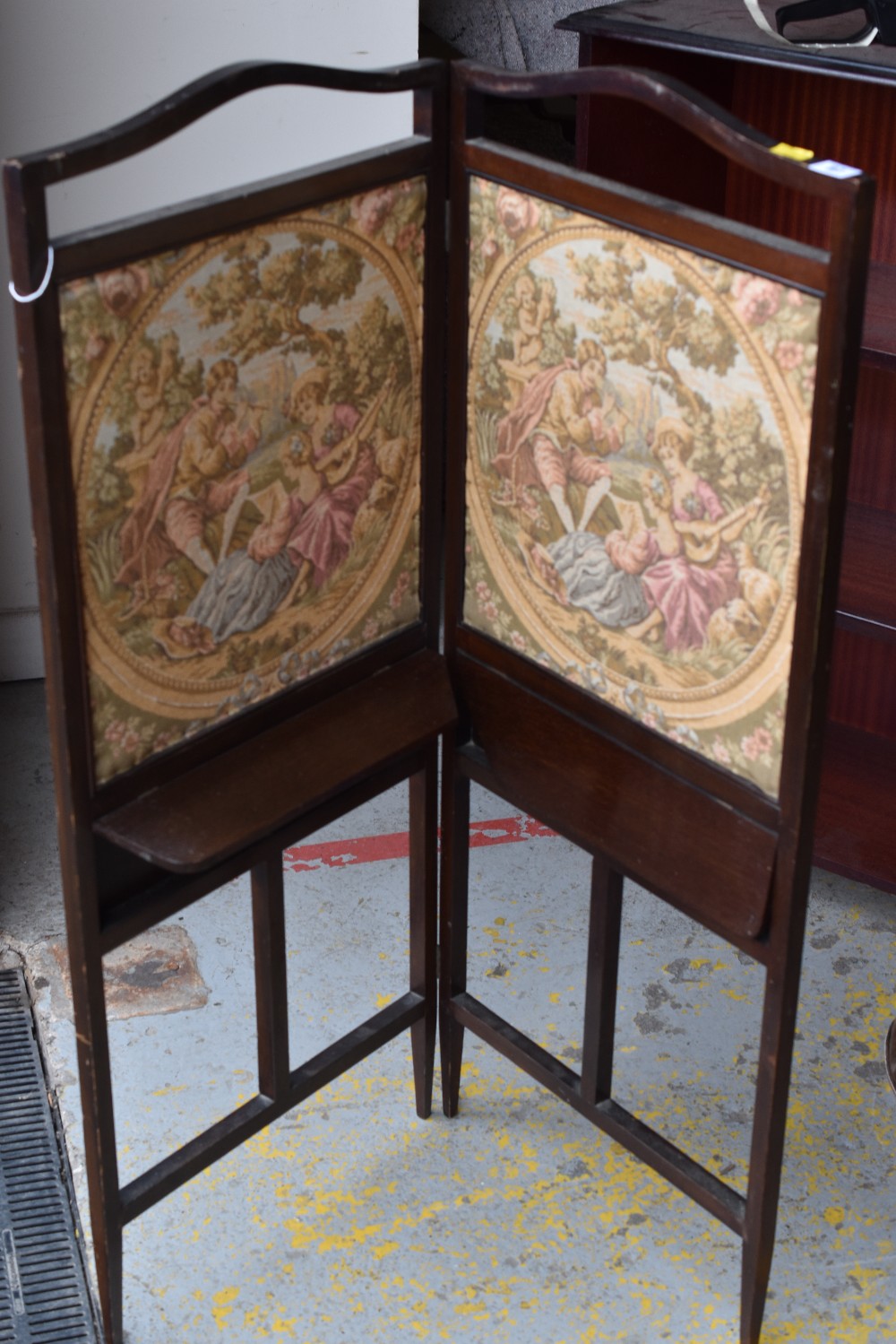 A folding tapestry screen with fold out shelf