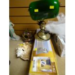 A boxed 3-spot ceiling light, a brass and green shade desk lamp, a small brass diving helmet etc