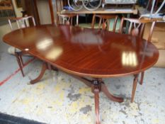 A regency-style dining suite comprising serpentine standing sideboard, twin pedestal dining table