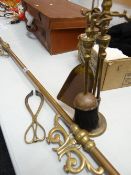 A brass pole and brass fireside companion