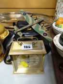 A late twentieth century bedroom clock, a model RAF bomber and two sets of binoculars