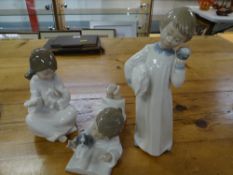 Three Nao figurines of night gowned children