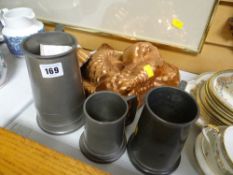 Three copper jelly moulds and three pewter tankards