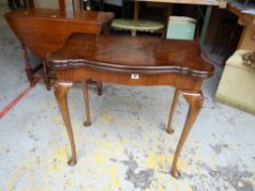 A baize lined polish walnut card table