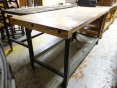 A lightwood top workbench on metal supports