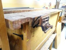 A workbench with solid sides and having a Record vice connected