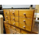 A good table top pine chest with bank of nine drawers