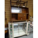 A kitsch vintage china cabinet with floral glass, a sliding door bookcase, two rush stools
