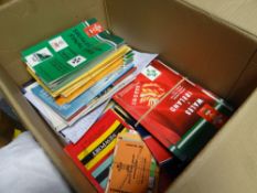 A box of sporting programmes including Cardiff Devils, Welsh rugby, Welsh football etc