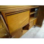 A retro Beaver & Tapley combination unit including bookcase and bureau