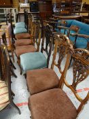 A set of ten Edwardian carved back dining room chairs