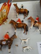 Four mounted Beswick huntsmen / women and two hunting dogs (damage to each piece)