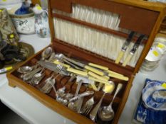 An oak canteen of mixed cutlery