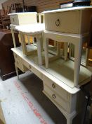 A cream painted Stag Minstrel dressing table, stool and pair of bedside tables and an antique