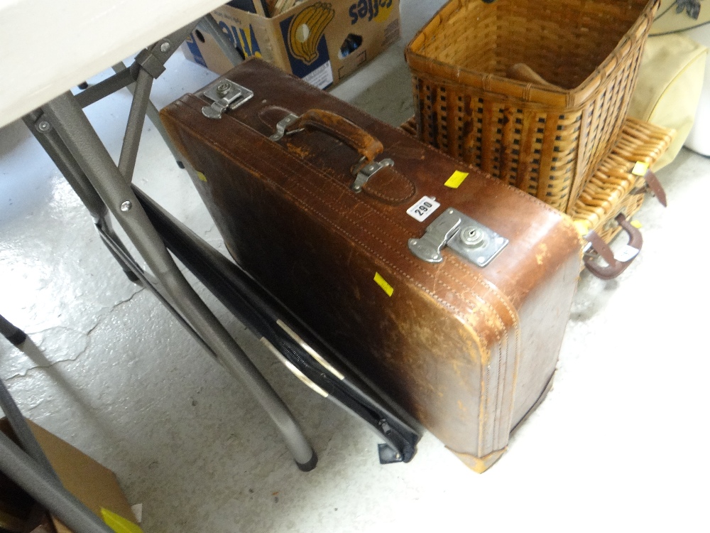 A good vintage leather suitcase and a black folder