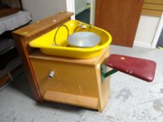 A late twentieth century potters wheel together with a large quantity of ceramic moulds and two