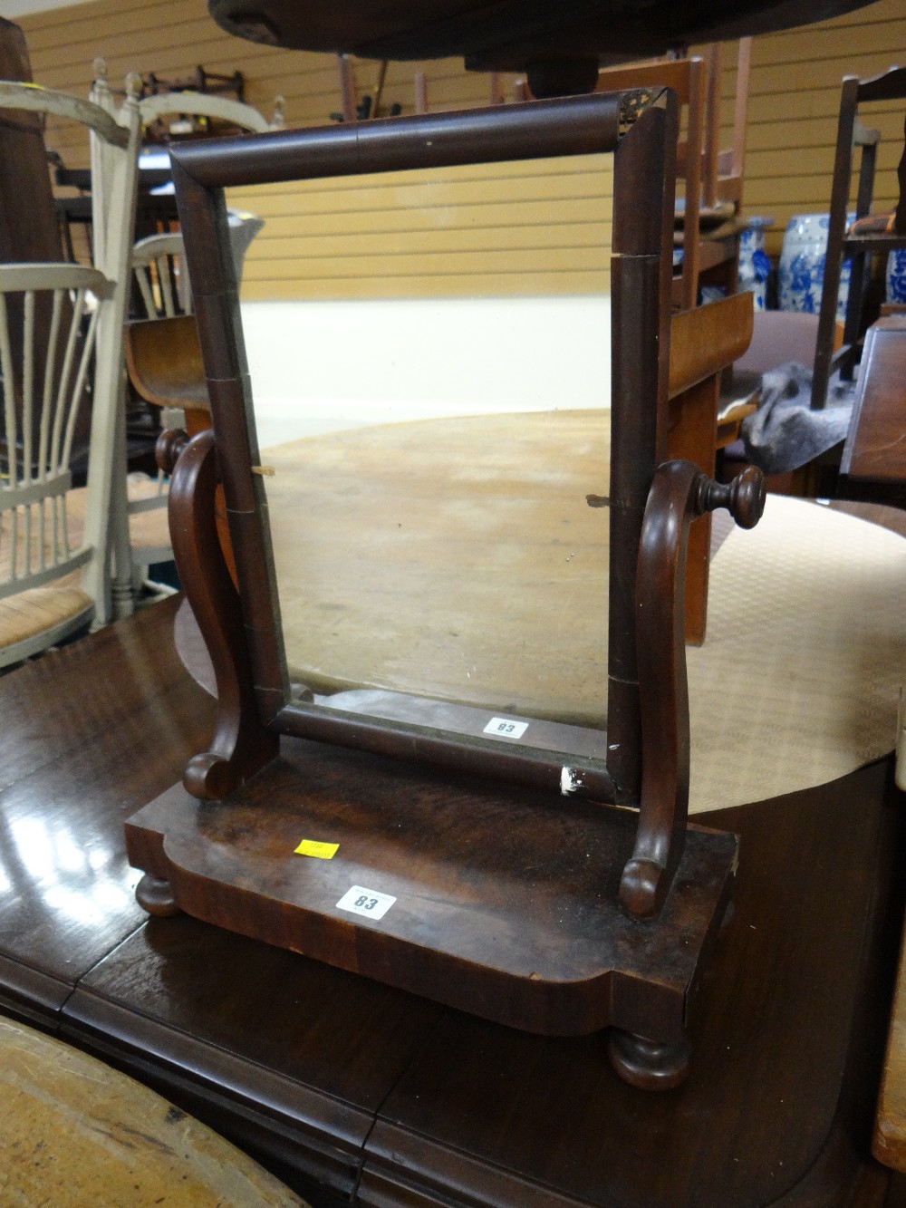 A mahogany veneered toilet mirror