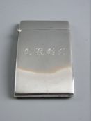 A HALLMARKED SILVER CALLING CARD CASE by Goldsmiths Company, the slightly curved case with hinged