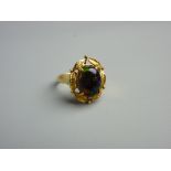 AN EIGHTEEN CARAT GOLD BLACK OPAL DRESS RING having an oval cabochon cut opal in a fancy leaf