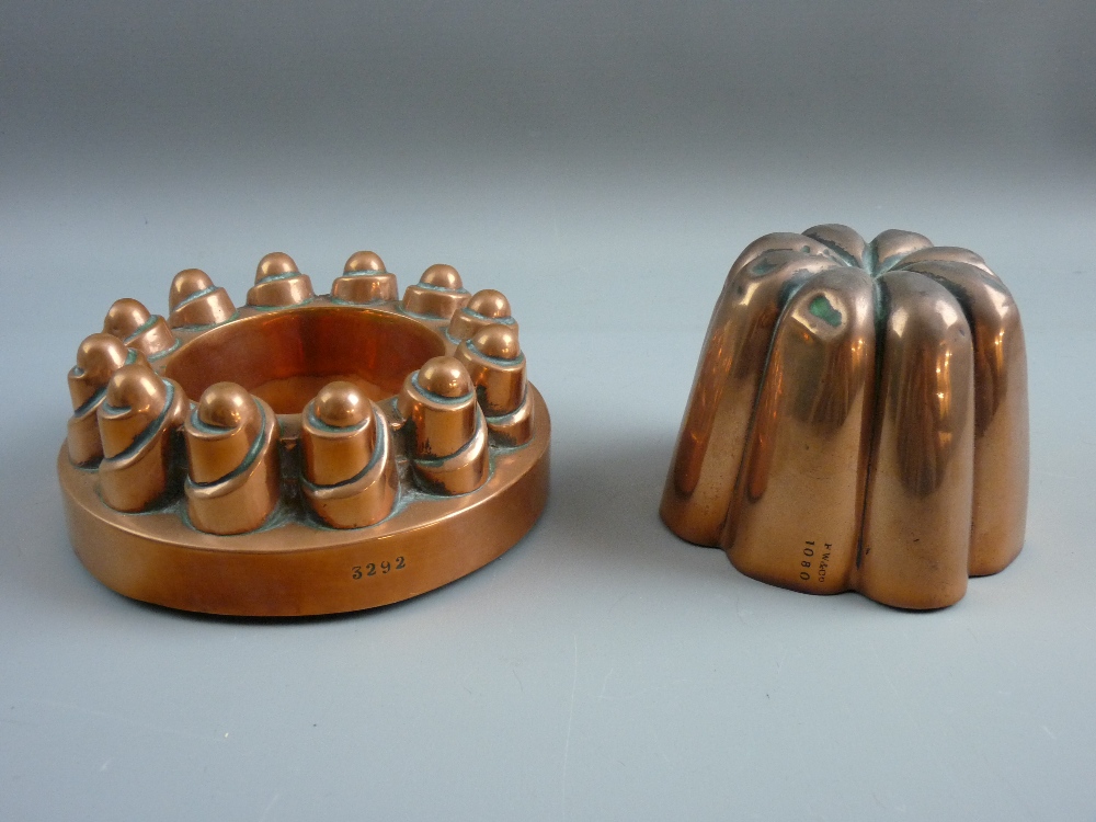 TWO VICTORIAN COPPER JELLY MOULDS, one circular form no. 3292, castellated with swirl formations,