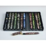 A COLLECTION OF TWELVE VINTAGE MARBLE PATTERN FOUNTAIN PENS to include a Conway Stewart 27, an